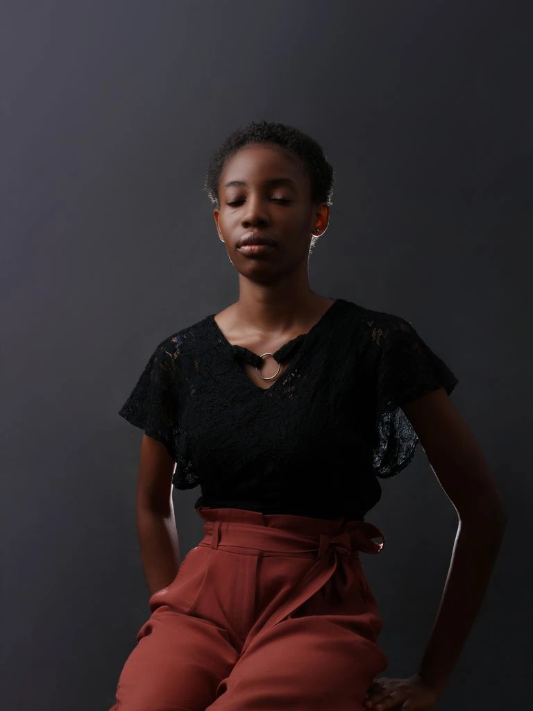 Portrait of YC-backed founder Maren Olu at her standing desk in Austin.